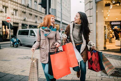 Girls Carrying Shopping Bags Stock Photo - Download Image Now - Shopping,  Retail, Sale - iStock