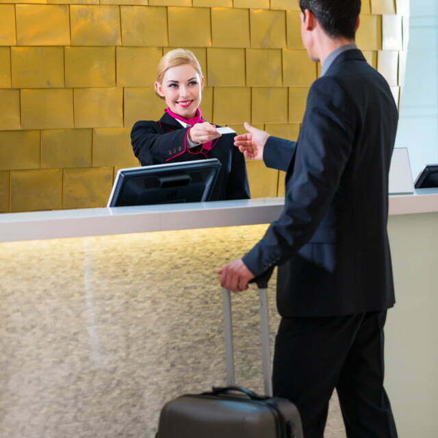 Hotel receptionist check in man giving key card - License, download or  print for £12.40 | Photos | Picfair